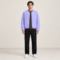 Manteau matelassé violet oversize vu de face, porté dans le studio IVAREE.